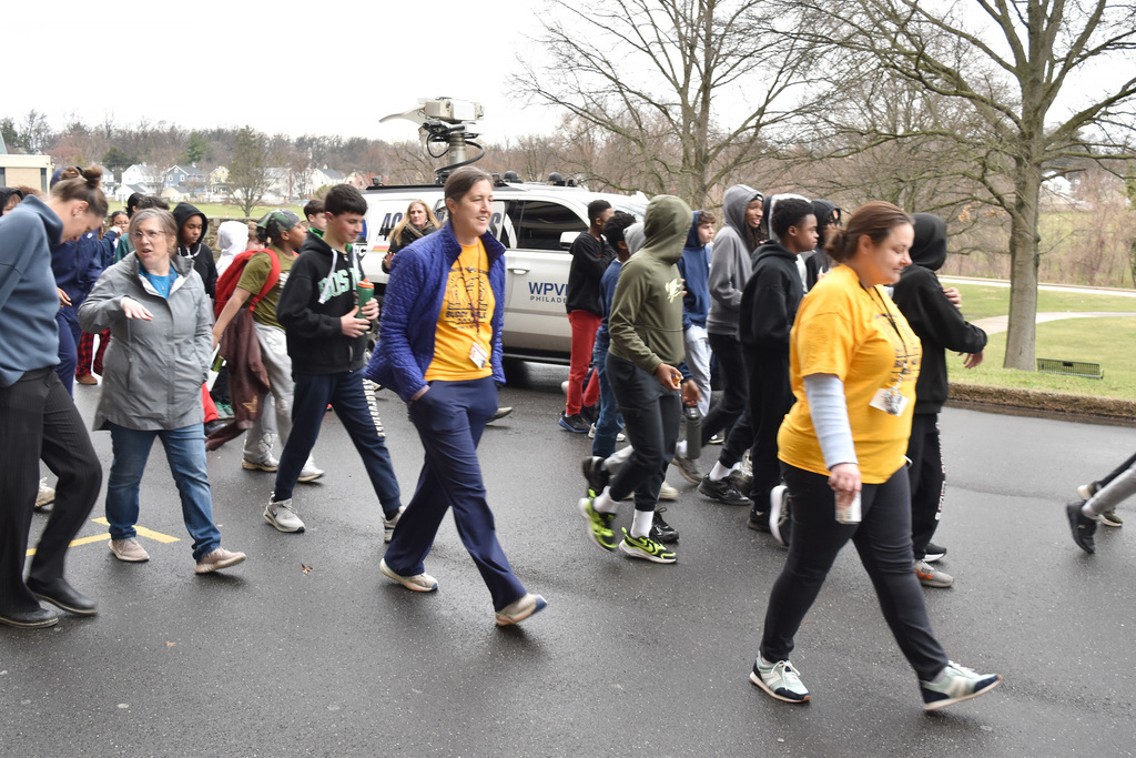 Students and teachers begin to walk together during the 9th Annual Buddy Walk.