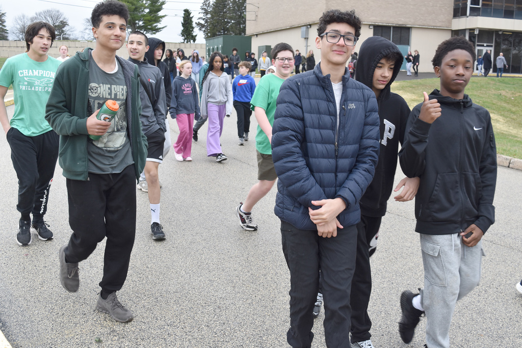 Several students walk together outside during the 9th Annual Buddy Walk.