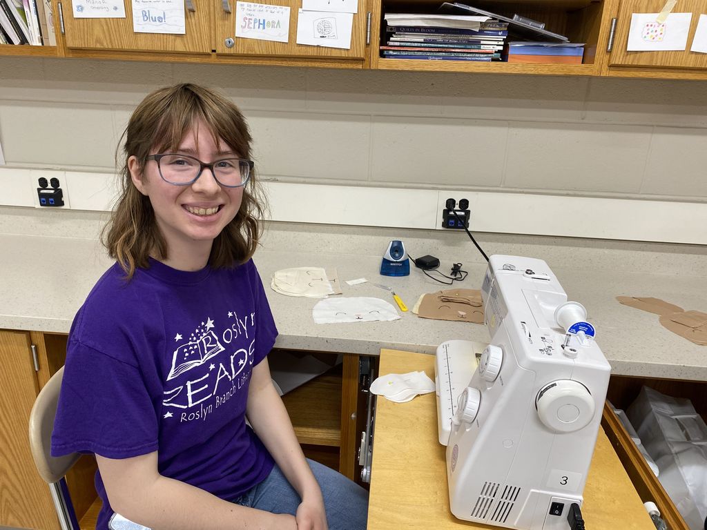 a girl at a sewing machine