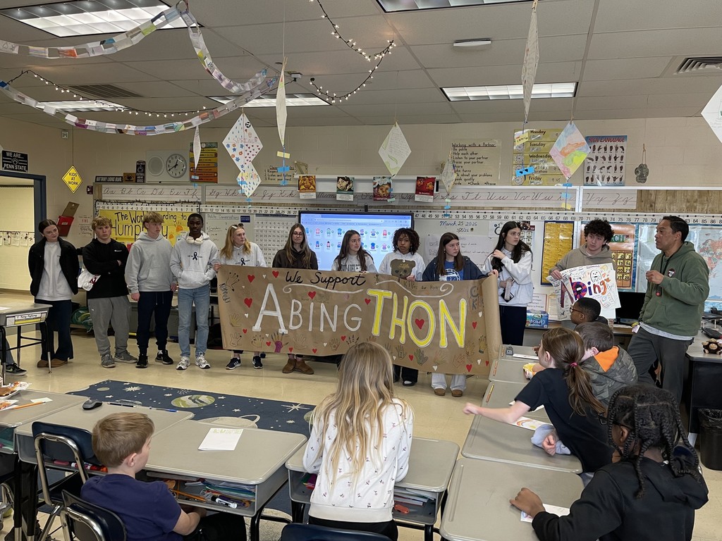 High school students are presented with an AbingTHON banner in Mr. Garcia's class