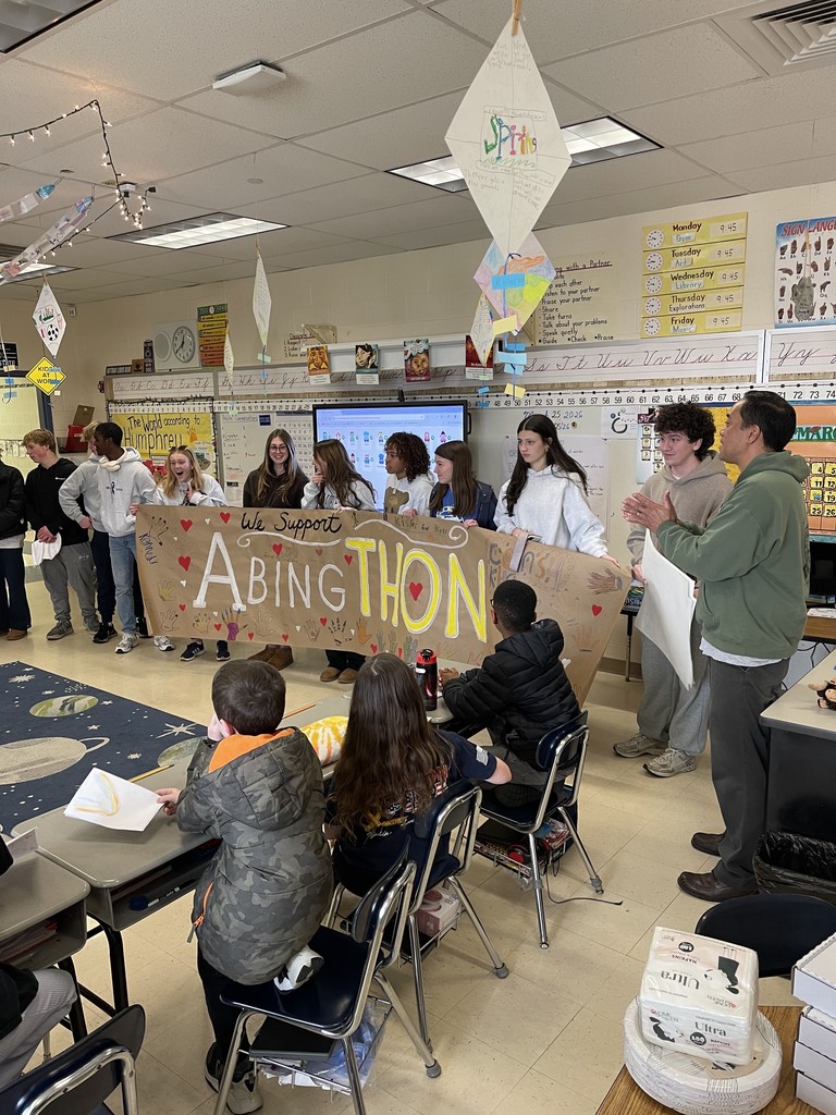 High school students are presented with an AbingTHON banner in Mr. Garcia's class