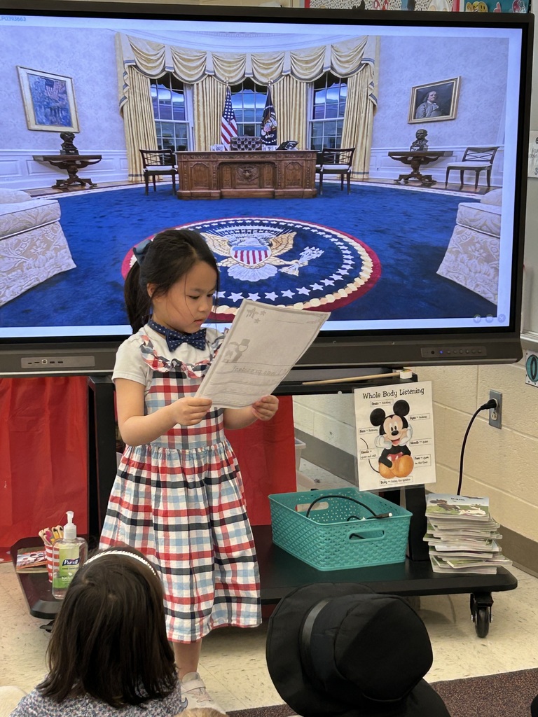 A student presenting their project dressed as a president