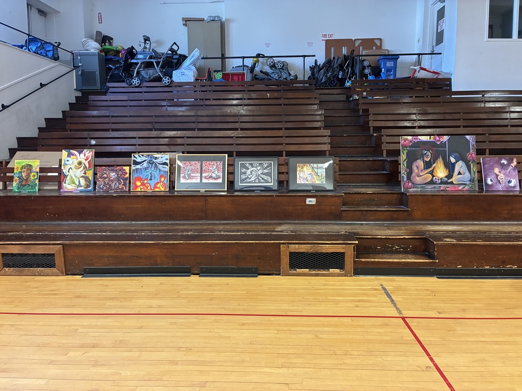 Portraits and Canvases on the side of the Exhibition