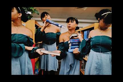 A photograph of 4 students in various poses by Reaghan Smith, grade 10