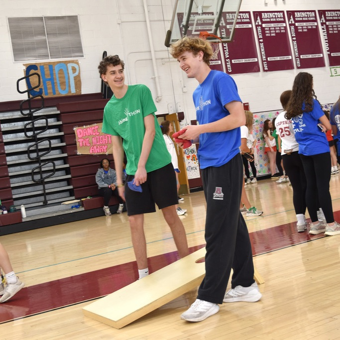 Green vs. blue ib a bean bag toss game