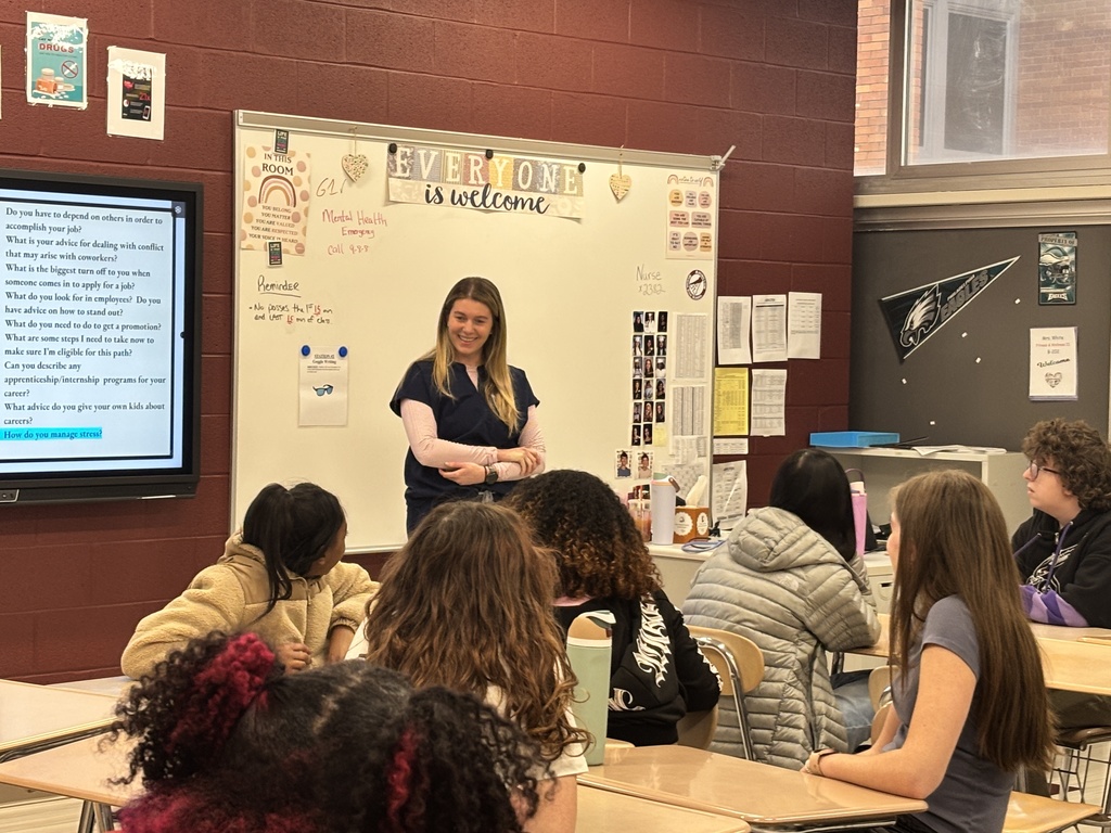 Kayla speaking to students.