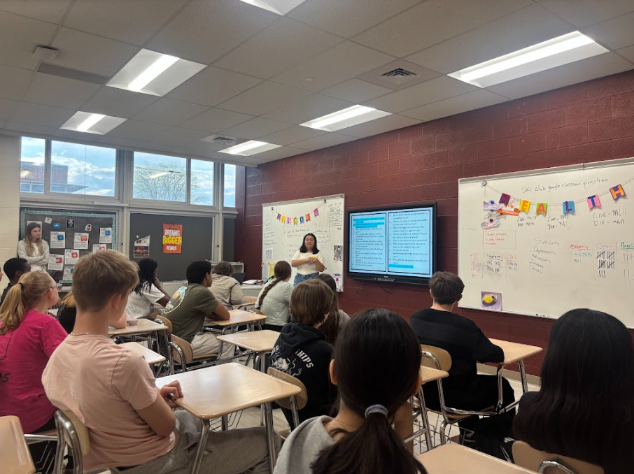 Guest speaker is teaching in front of the class