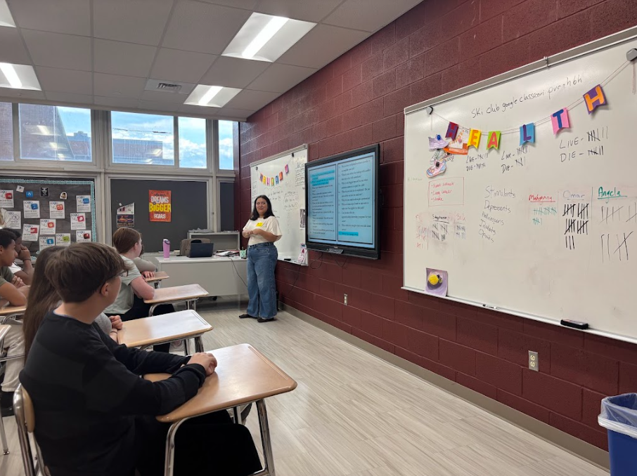 Guest speaker is teaching in front of the class