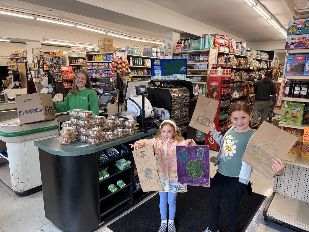 Students at the local market with their Earth Day bags