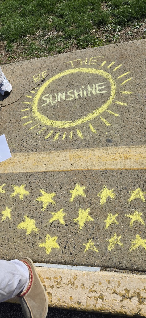 Image of Builders Club members decorating the bus loop.