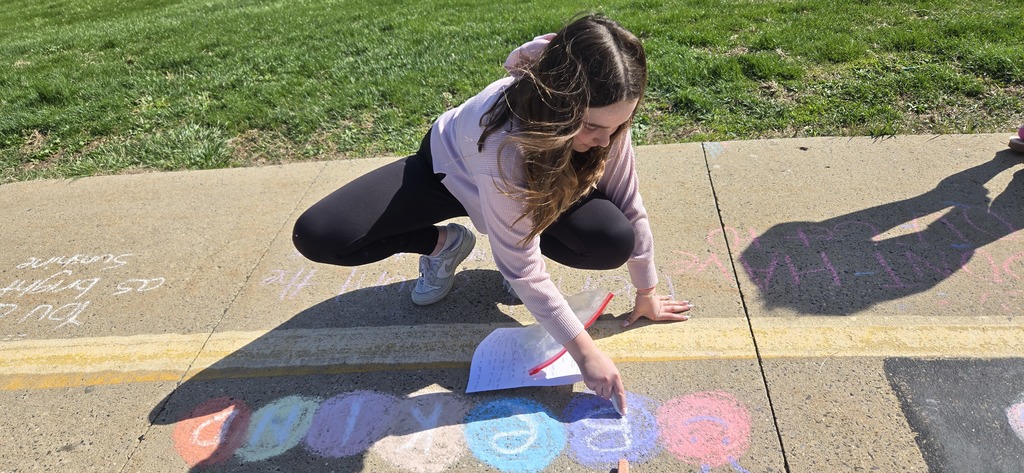 Image of Builders Club members decorating the bus loop.
