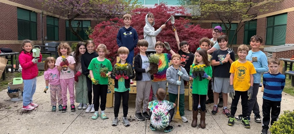 Students planting a garden for Earth Day