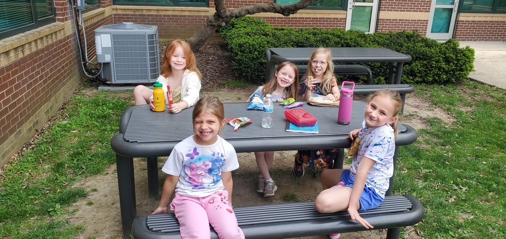 students smiling outside