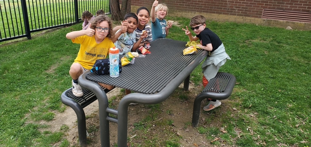 students smiling outside