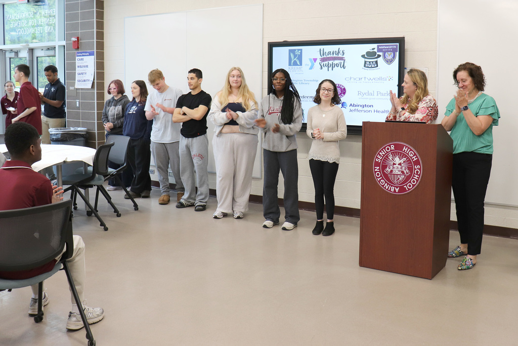 ACTIVE Academy program volunteers are recognized at the podium