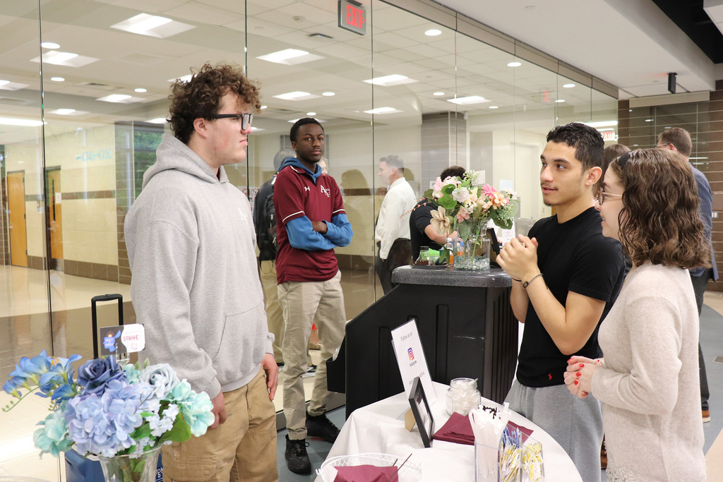 An ACTIVE Academy student converses with program volunteers.