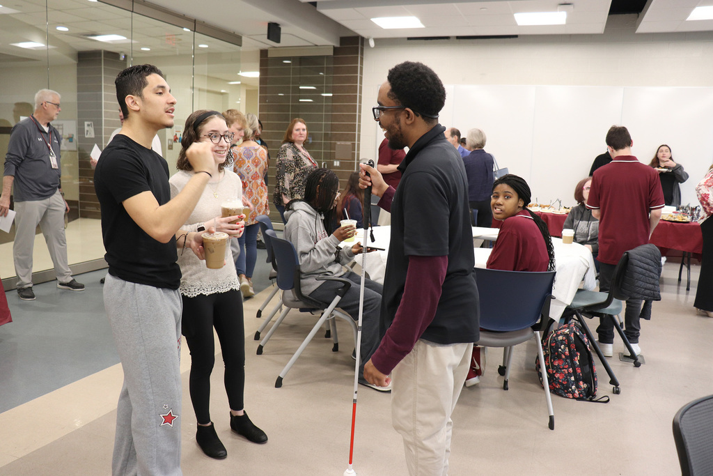 An ACTIVE Academy student converses with program volunteers.