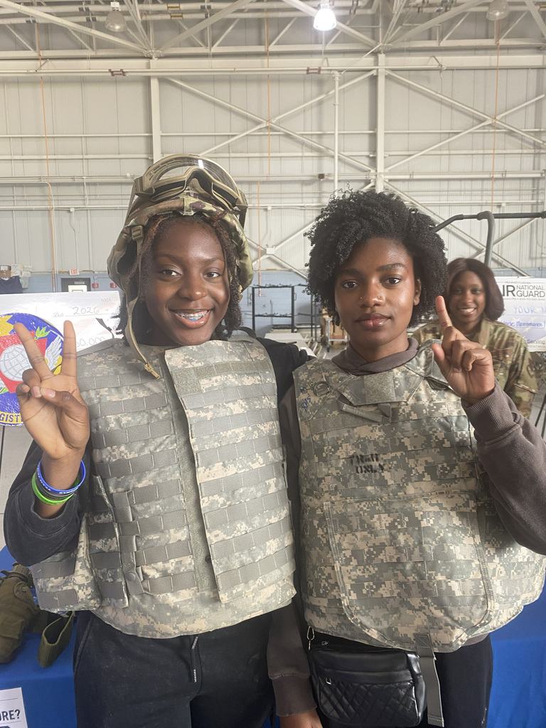 2 ASHS students are dressed in gear for hazardous situations