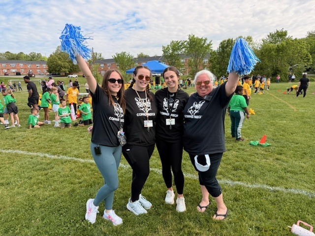 staff smiling at field day