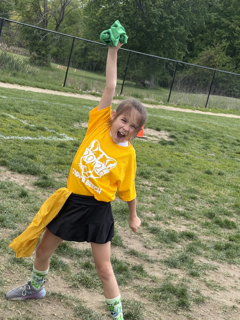 student celebrating a field day win