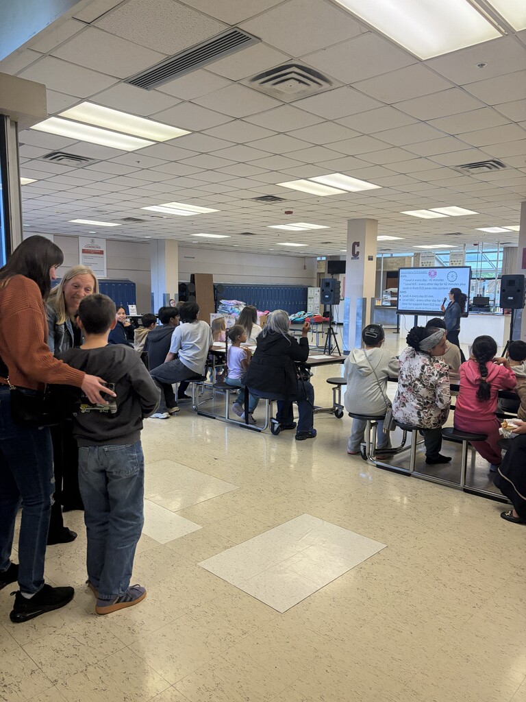 Ms. Allison Renye presents to families in Commons C
