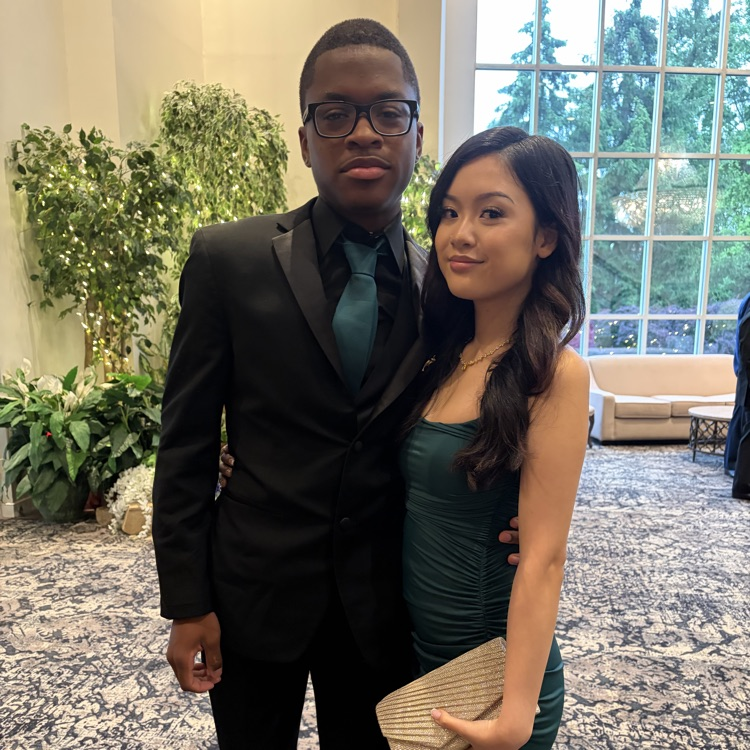 Students at prom in matching green attire