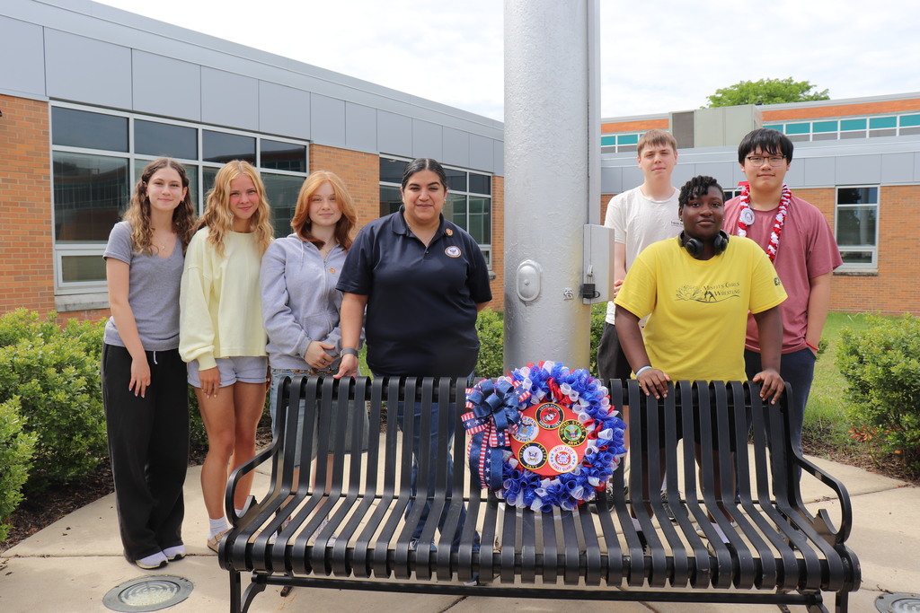 Military Club with the wreath for Memorial Day, which sits on an empty bench