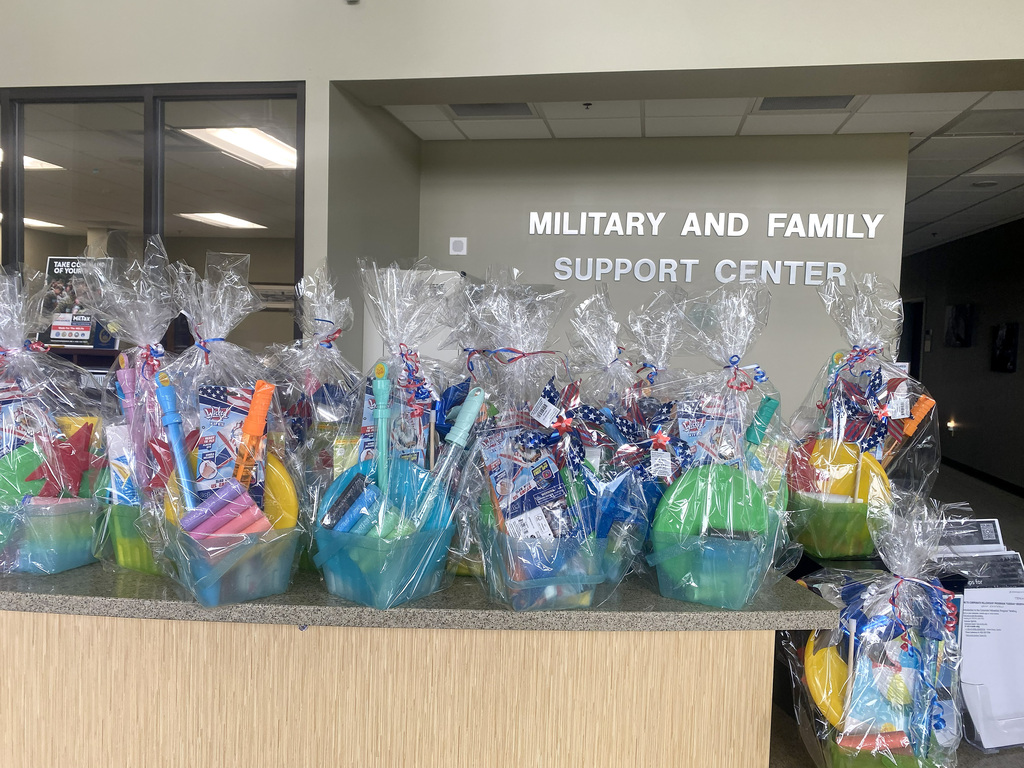 Donated Summer Toy Gift Baskets are lined up at the Military and Support Center