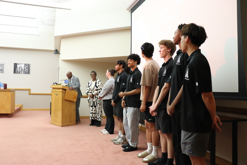 Boys volleyball team being honored at the Board meeting