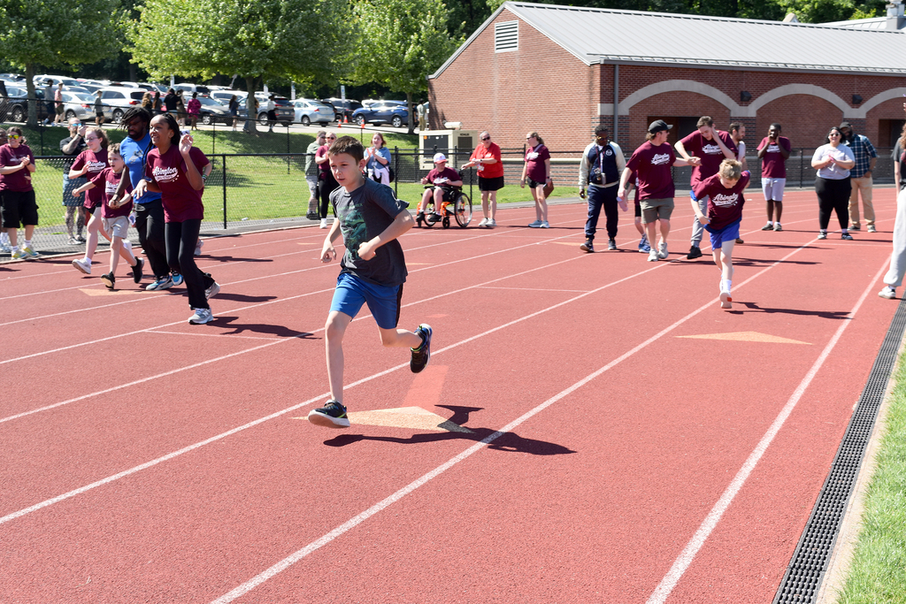 Students are running in a race on the track