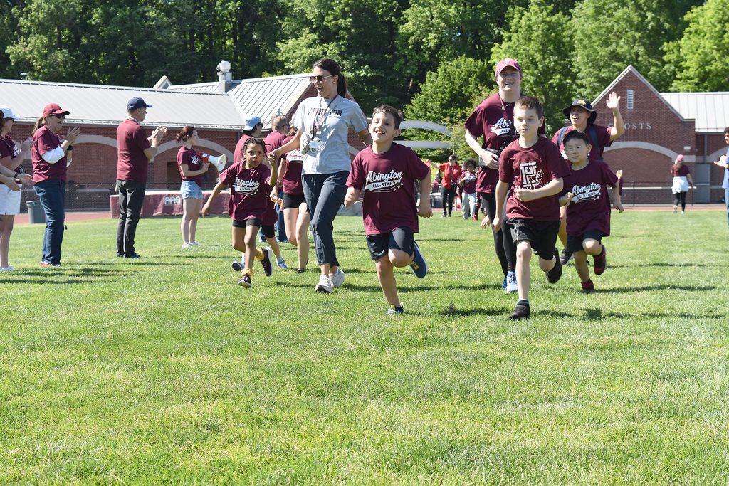 Students and staff run into the stadium excited to begin the event