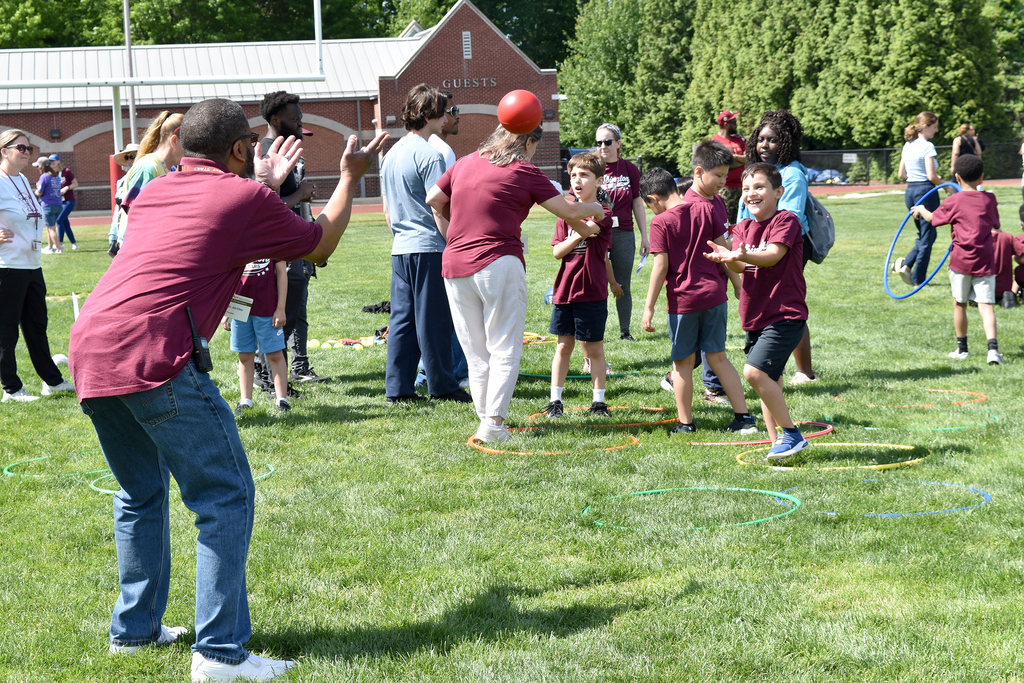Dr. Etlen plays catch with a student