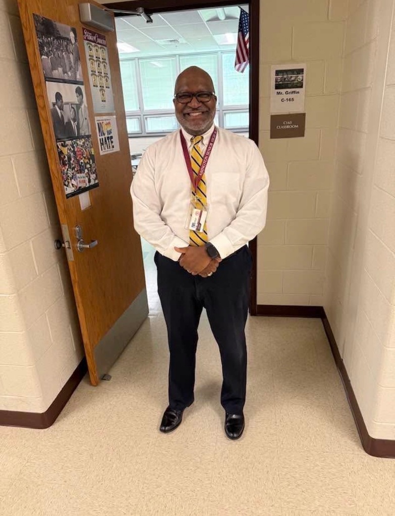 Mr. Griffin in front of his classroom