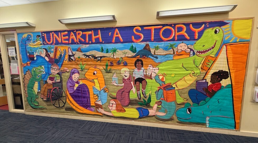 The finished mural, "Unearth a Story" in Abington Free Library Children's Department