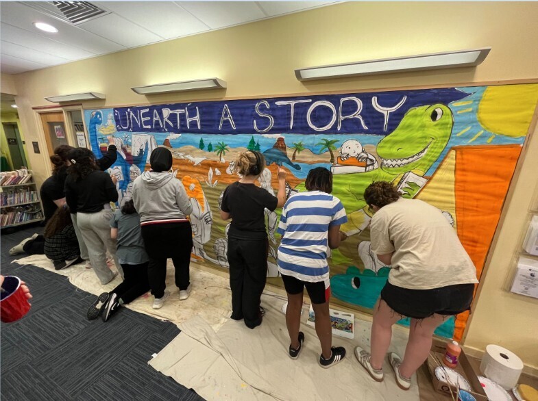 ASHS students are painting a mural in Abington Free Library Children's Department