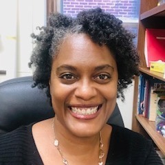 Dr. Wormley at her desk