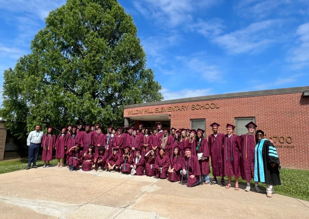 Students at Willow Hill take a group photo in their caps and gowns