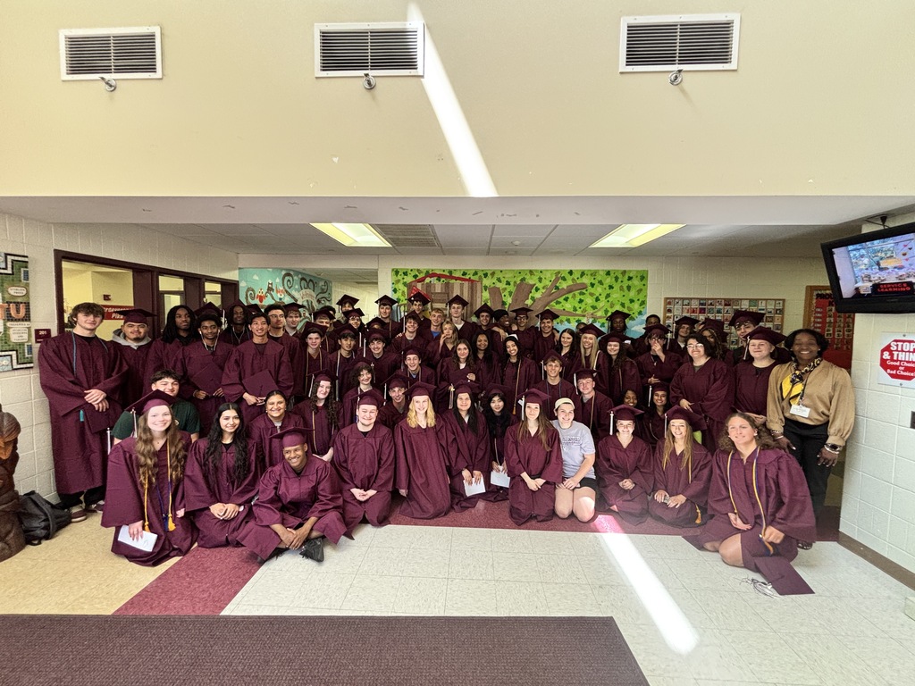 Students at Overlook take a group photo in their caps and gowns