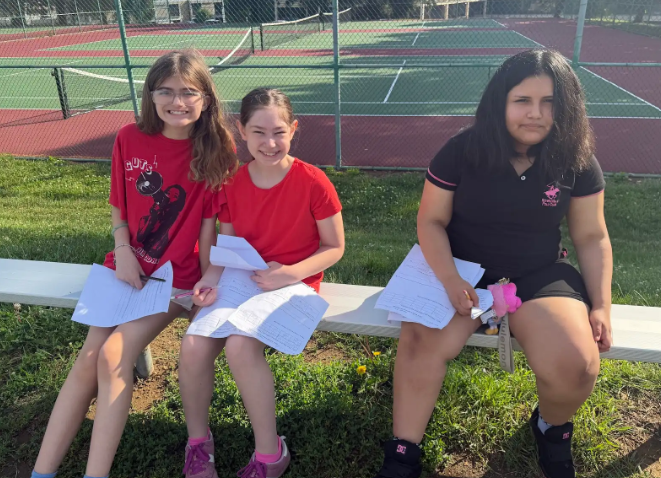 Image of 6th grade math students testing their paper airplanes