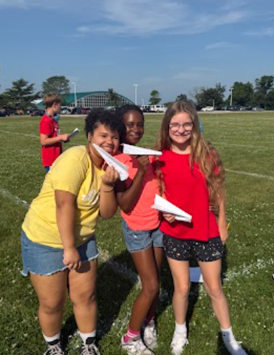 Image of 6th grade math students testing their paper airplanes