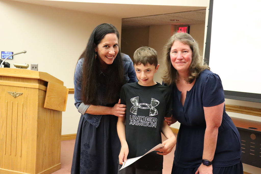 Ms. Captiolo and Ms. Miller with one of the student athletes