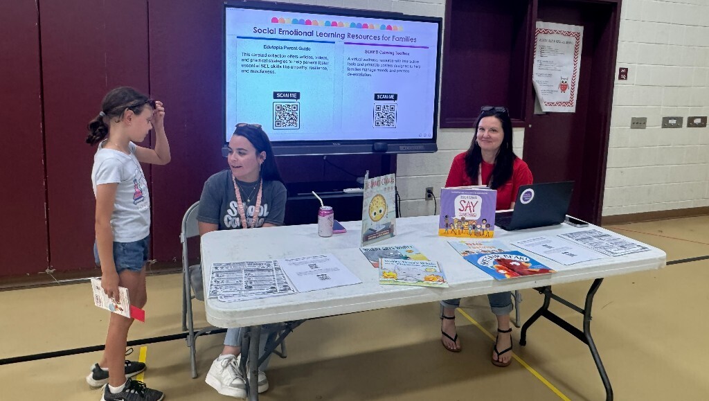 Overlook staff assist a student at the resource fair.