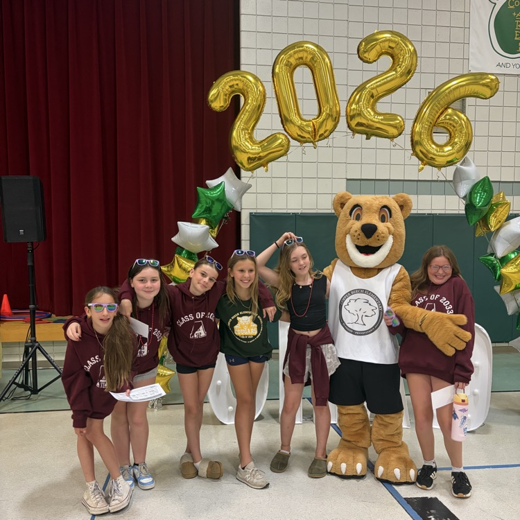 Students with Cougar Carl in front of 2026 Balloon arch