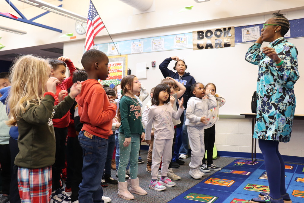 Author leads students in an activity 
