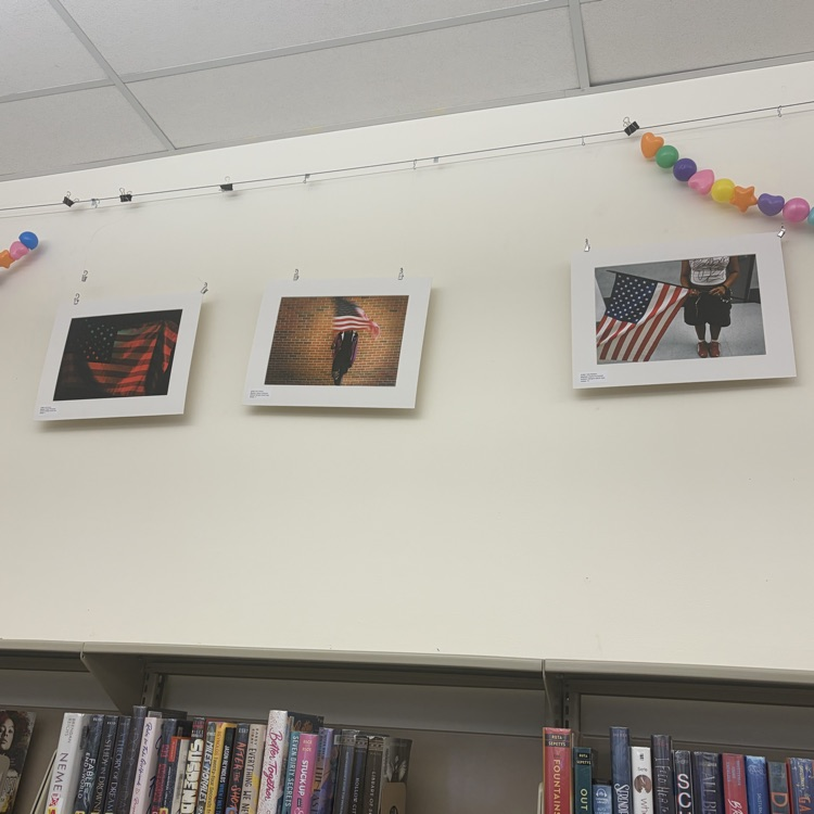 Digital photos of the American flag, taken by high school students, on display
