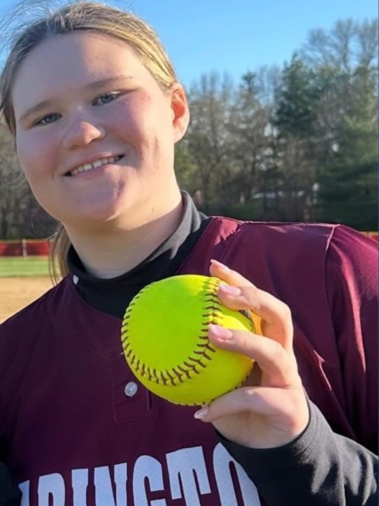 Photo of Sophia Dever holding a softball