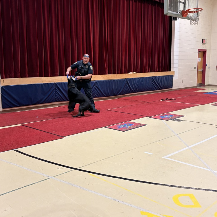 Shadow demonstrates the tricks he knows with Officer Jones