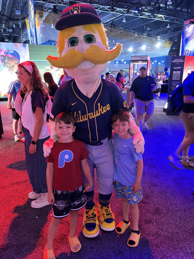 Luca and Nico pose with an MLB mascot at the all star week celebration
