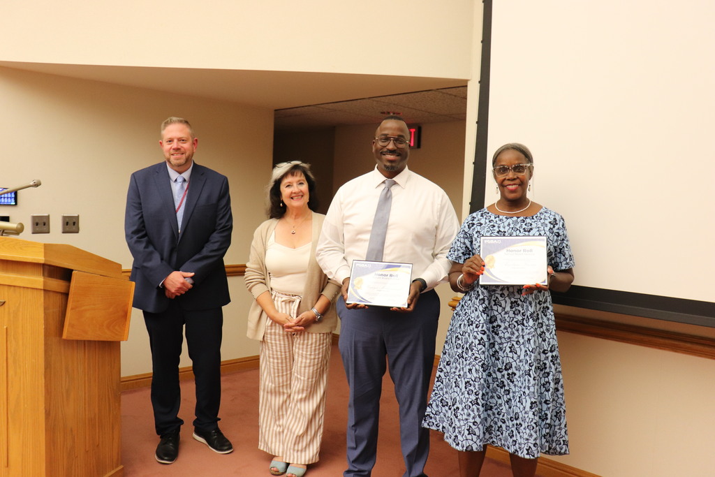Dr. Fecher and Dr. Mowry alongside Mr. Muhammad and Ms. Frazier, who hold recognition certificates