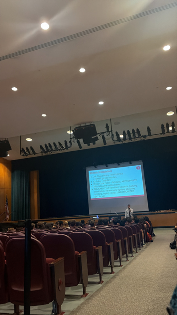 administrator welcoming students